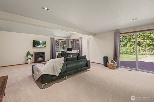 5990 6th Ave SE, Lacey, WA 98503 - carpeted living area featuring baseboards, a glass covered fireplace, recessed lighting, and vaulted ceiling