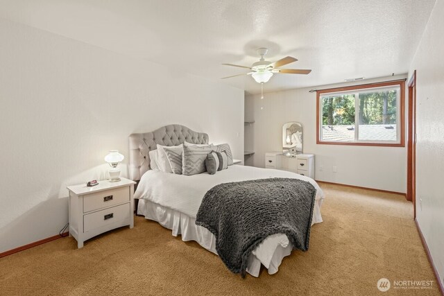 5990 6th Ave SE, Lacey, WA 98503 - bedroom featuring light carpet, baseboards, and ceiling fan