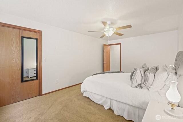5990 6th Ave SE, Lacey, WA 98503 - bedroom with light colored carpet, baseboards, and ceiling fan