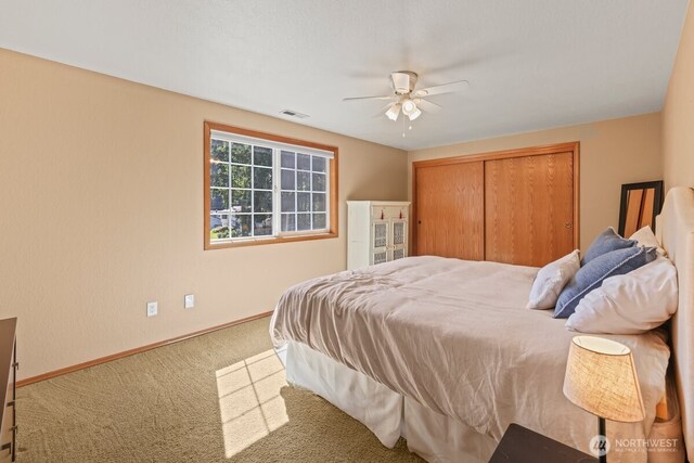 5990 6th Ave SE, Lacey, WA 98503 - bedroom with carpet flooring, baseboards, a closet, and ceiling fan
