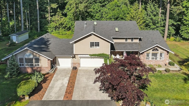 5990 6th Ave SE, Lacey, WA 98503 - view of front of home featuring brick siding, concrete driveway, a front yard, and an attached garage