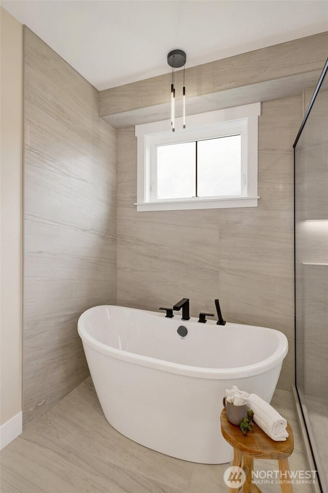 5712 Denali Ln, Bellingham, WA 98226 - bathroom featuring a freestanding tub, wood finished floors, and a shower
