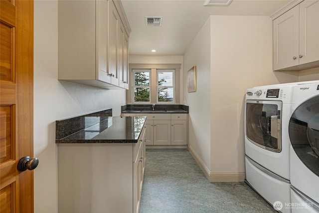 148 Yarrow Rd, Friday Harbor, WA 98250 - laundry area featuring cabinet space, separate washer and dryer, recessed lighting, and baseboards