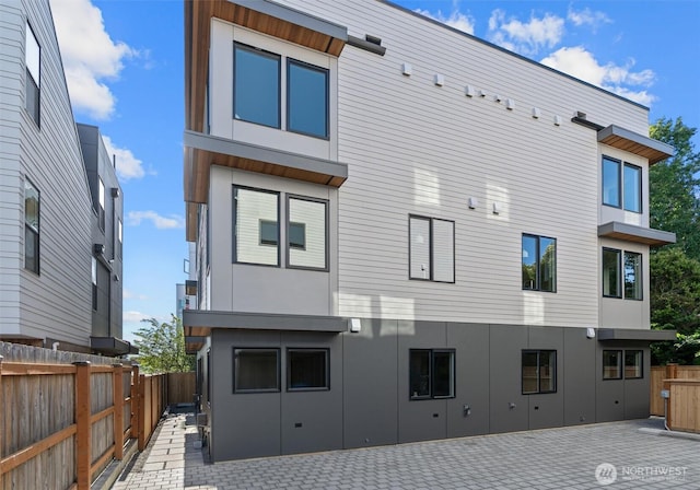 4519A Bagley Ave N, Seattle, WA 98103 - rear view of house featuring a patio area, a fenced backyard, and stucco siding