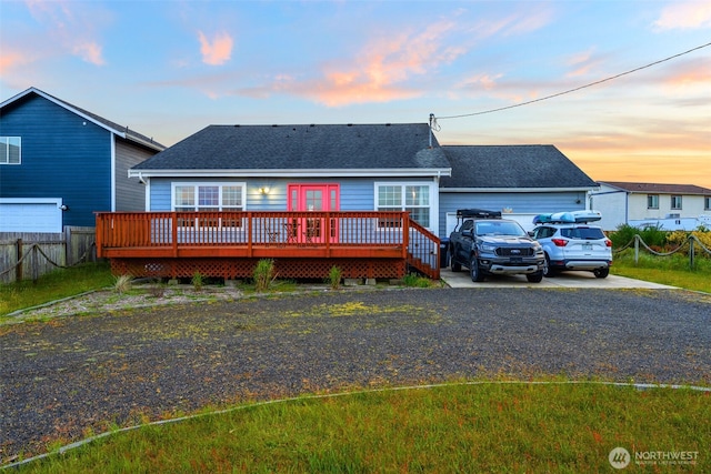 1291 Channel Ave SW, Ocean Shores, WA 98569 - ranch-style house featuring a shingled roof, a wooden deck, and concrete driveway