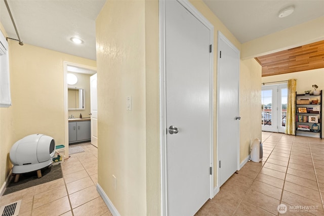 1291 Channel Ave SW, Ocean Shores, WA 98569 - corridor with light tile patterned floors, baseboards, and recessed lighting
