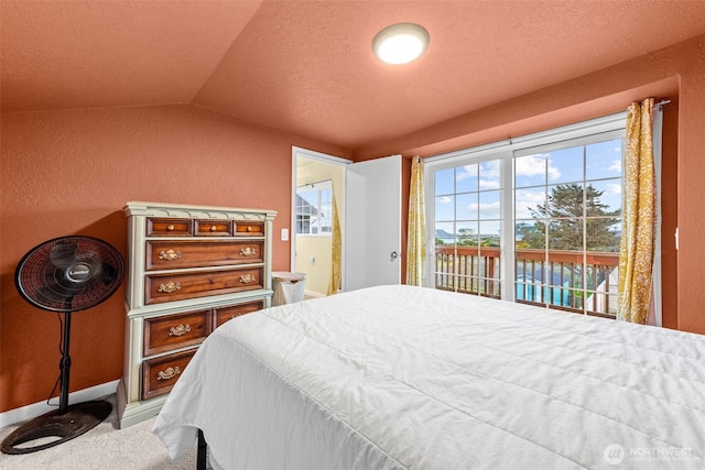 1291 Channel Ave SW, Ocean Shores, WA 98569 - carpeted bedroom with access to outside, lofted ceiling, and a textured wall