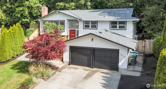 2015 172nd Pl SE, Bothell, WA 98012 - raised ranch with roof with shingles, concrete driveway, and a chimney