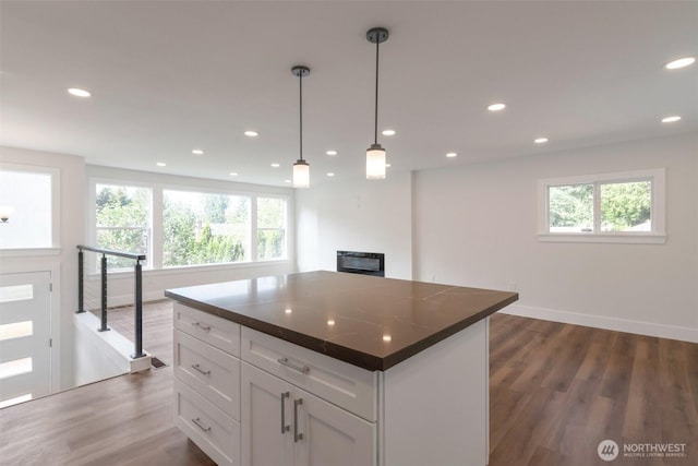 2015 172nd Pl SE, Bothell, WA 98012 - kitchen with healthy amount of natural light, dark wood-type flooring, a center island, and recessed lighting