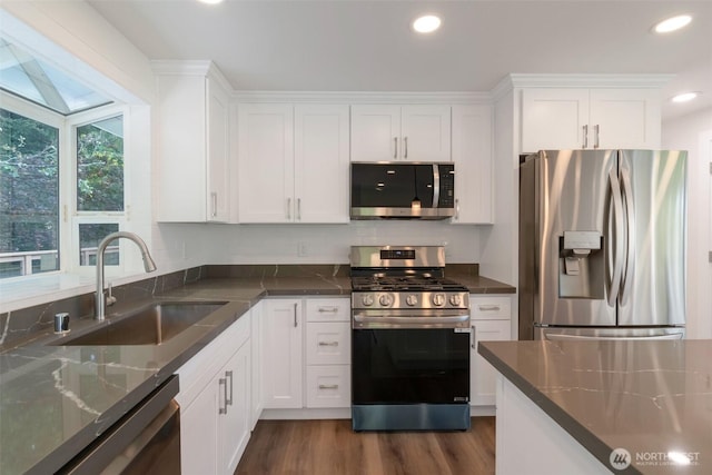 2015 172nd Pl SE, Bothell, WA 98012 - kitchen with appliances with stainless steel finishes, a sink, white cabinets, and recessed lighting