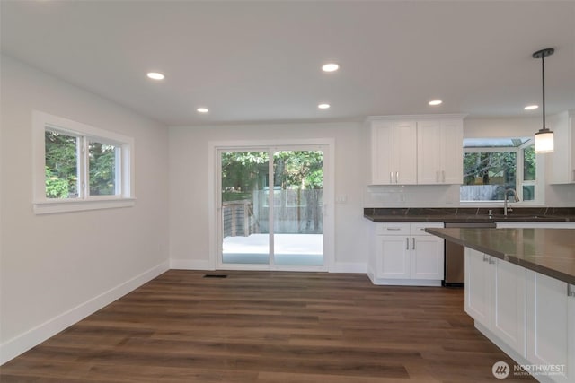 2015 172nd Pl SE, Bothell, WA 98012 - kitchen with dishwasher, dark countertops, baseboards, and recessed lighting