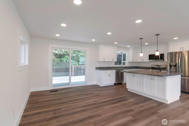 2015 172nd Pl SE, Bothell, WA 98012 - kitchen with appliances with stainless steel finishes, dark countertops, white cabinetry, and recessed lighting