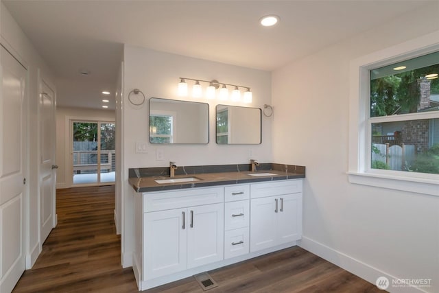 2015 172nd Pl SE, Bothell, WA 98012 - full bathroom featuring wood finished floors, double vanity, baseboards, and recessed lighting