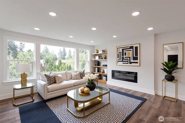 2015 172nd Pl SE, Bothell, WA 98012 - living room featuring a glass covered fireplace, baseboards, recessed lighting, and wood finished floors