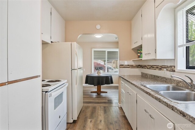 2938 Field St, Longview, WA 98632 - kitchen featuring white electric range oven, a sink, dark wood finished floors, and white cabinetry