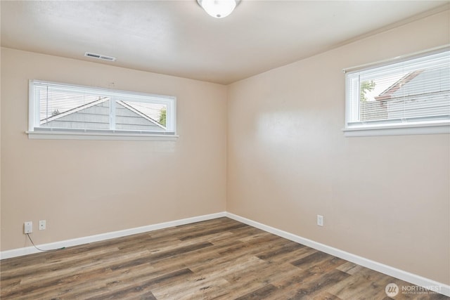 2938 Field St, Longview, WA 98632 - unfurnished room with plenty of natural light, baseboards, and wood finished floors
