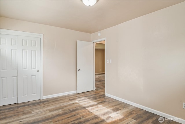 2938 Field St, Longview, WA 98632 - unfurnished bedroom with baseboards, wood finished floors, and a closet