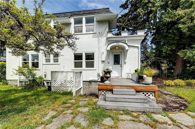 1324 E 2nd St, Port Angeles, WA 98362 - view of front of property with stucco siding and a deck
