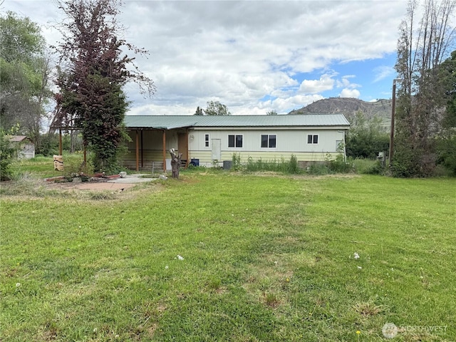 1485B Old Hwy 97, Malott, WA 98840 - rear view of property featuring a yard, a mountain view, and metal roof