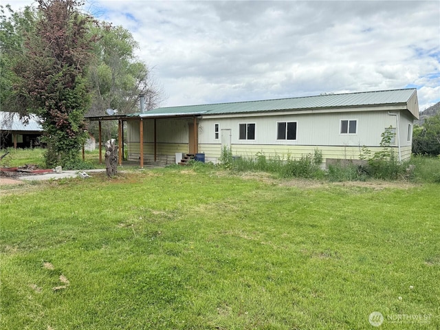 1485B Old Hwy 97, Malott, WA 98840 - rear view of house featuring a lawn and metal roof