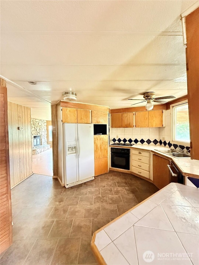 1485B Old Hwy 97, Malott, WA 98840 - kitchen featuring black appliances, tile counters, a sink, tasteful backsplash, and a ceiling fan