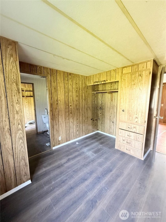 1485B Old Hwy 97, Malott, WA 98840 - unfurnished bedroom featuring wood finished floors, wooden walls, and baseboards