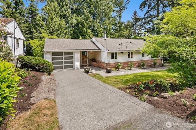 1256 NE 188th St, Shoreline, WA 98155 - single story home featuring an attached garage, driveway, and a shingled roof