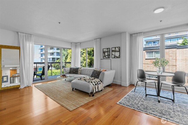 500 5th Ave W Unit 501, Seattle, WA 98119 - living area with healthy amount of natural light, wood finished floors, and baseboards