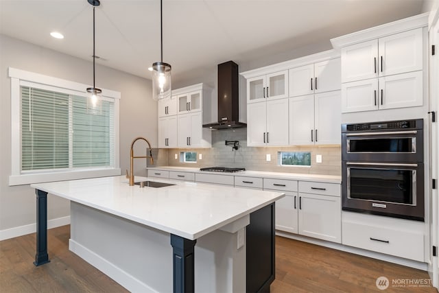 7547 S 130th Pl, Seattle, WA 98178 - kitchen featuring wall chimney range hood, a sink, double oven, dark wood-style flooring, and recessed lighting