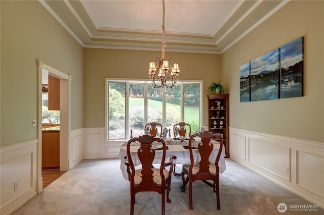 5920 228th Ave NE, Redmond, WA 98053 - dining space featuring a chandelier, plenty of natural light, a raised ceiling, light carpet, and a decorative wall