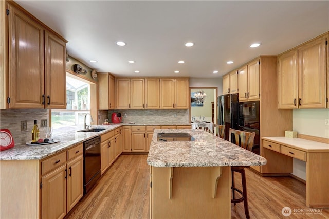 5920 228th Ave NE, Redmond, WA 98053 - kitchen with black appliances, a sink, a center island, light wood finished floors, and recessed lighting