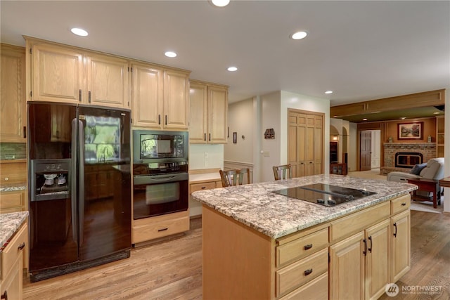 5920 228th Ave NE, Redmond, WA 98053 - kitchen with black appliances, light brown cabinetry, light wood-style flooring, and recessed lighting