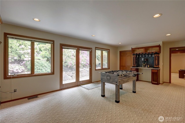 5920 228th Ave NE, Redmond, WA 98053 - rec room featuring light carpet, a bar, healthy amount of natural light, and recessed lighting