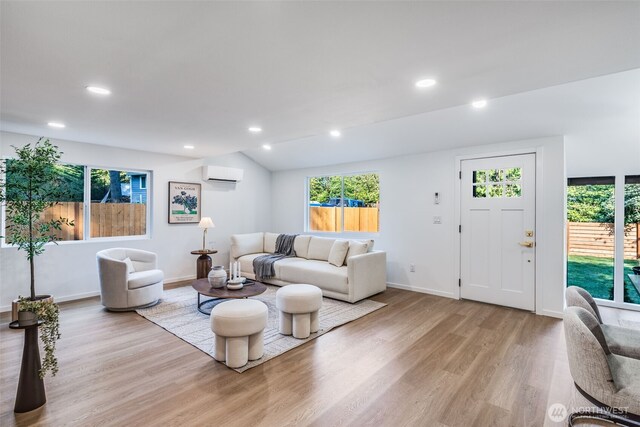 3718 W Arsenal Way, Bremerton, WA 98312 - living room featuring a wall mounted AC, light wood-style flooring, healthy amount of natural light, and recessed lighting