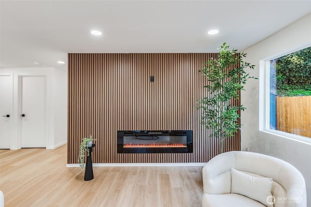 3718 W Arsenal Way, Bremerton, WA 98312 - living room featuring wood finished floors, a glass covered fireplace, recessed lighting, and baseboards