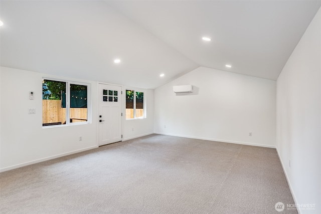 3718 W Arsenal Way, Bremerton, WA 98312 - unfurnished living room with carpet floors, a wall unit AC, recessed lighting, lofted ceiling, and baseboards