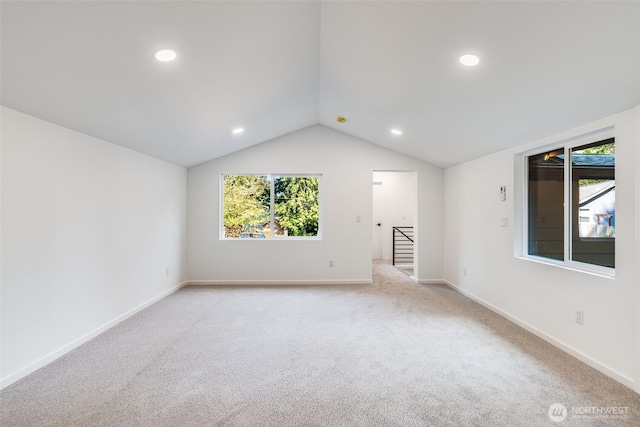 3718 W Arsenal Way, Bremerton, WA 98312 - empty room featuring vaulted ceiling, light carpet, baseboards, and recessed lighting