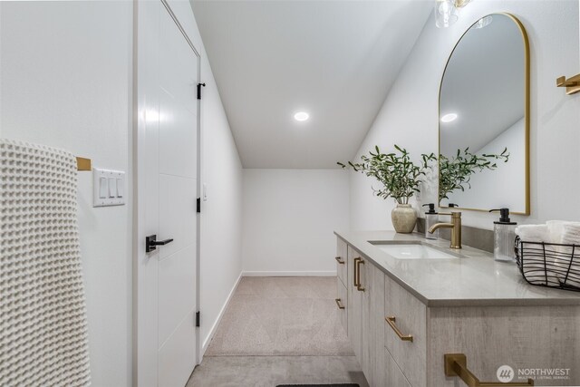 3718 W Arsenal Way, Bremerton, WA 98312 - bathroom featuring vanity, lofted ceiling, baseboards, and recessed lighting