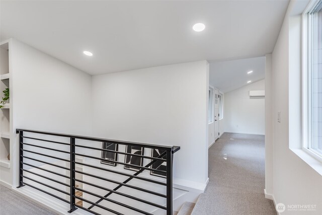 3718 W Arsenal Way, Bremerton, WA 98312 - hall with carpet floors, a wall unit AC, baseboards, recessed lighting, and vaulted ceiling