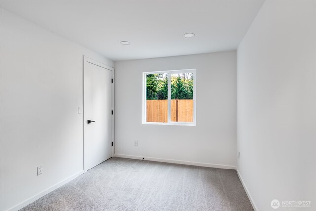 3718 W Arsenal Way, Bremerton, WA 98312 - carpeted empty room featuring baseboards and recessed lighting