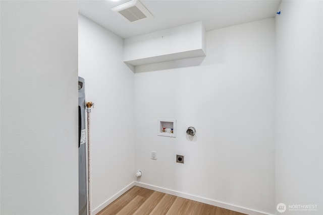 3718 W Arsenal Way, Bremerton, WA 98312 - laundry area featuring electric dryer hookup, washer hookup, light wood finished floors, and baseboards