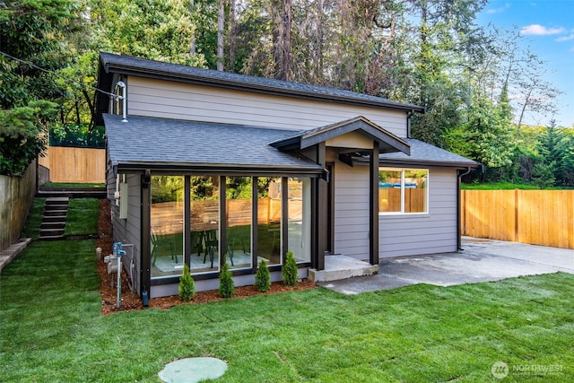 3718 W Arsenal Way, Bremerton, WA 98312 - rear view of property featuring a shingled roof and a patio