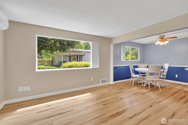348 7th Pl SE Unit 1, Puyallup, WA 98372 - dining room featuring wood finished floors, ceiling fan, and an AC wall unit