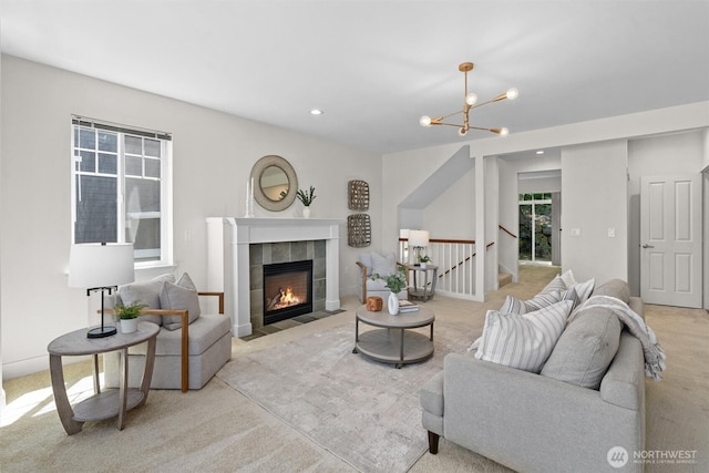 5529 Lakemont Blvd SE Unit 901, Bellevue, WA 98006 - carpeted living room with a chandelier, a fireplace, and recessed lighting