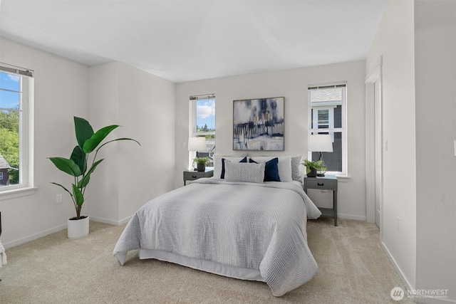 5529 Lakemont Blvd SE Unit 901, Bellevue, WA 98006 - carpeted bedroom featuring multiple windows and baseboards