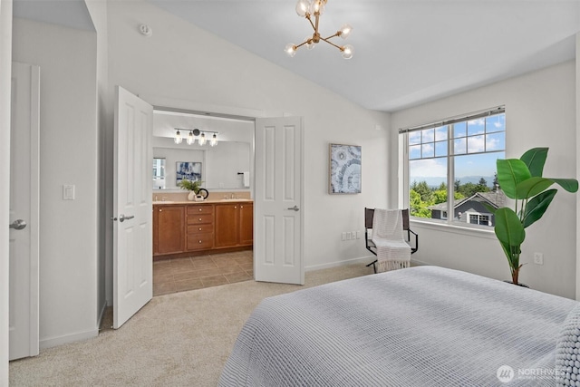 5529 Lakemont Blvd SE Unit 901, Bellevue, WA 98006 - bedroom featuring a chandelier, light carpet, a sink, baseboards, and ensuite bath
