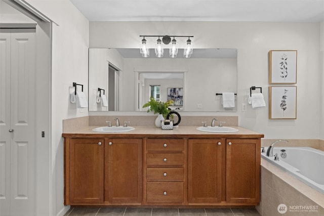 5529 Lakemont Blvd SE Unit 901, Bellevue, WA 98006 - full bathroom featuring double vanity, a bath, tile patterned floors, and a closet