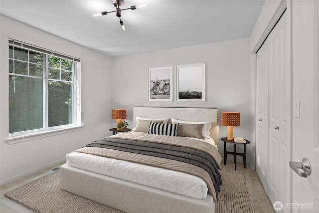 5529 Lakemont Blvd SE Unit 901, Bellevue, WA 98006 - carpeted bedroom with a closet and baseboards
