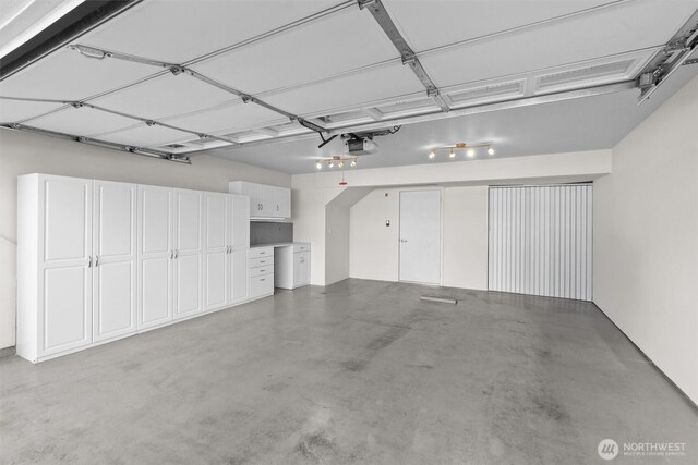 5529 Lakemont Blvd SE Unit 901, Bellevue, WA 98006 - garage featuring a garage door opener