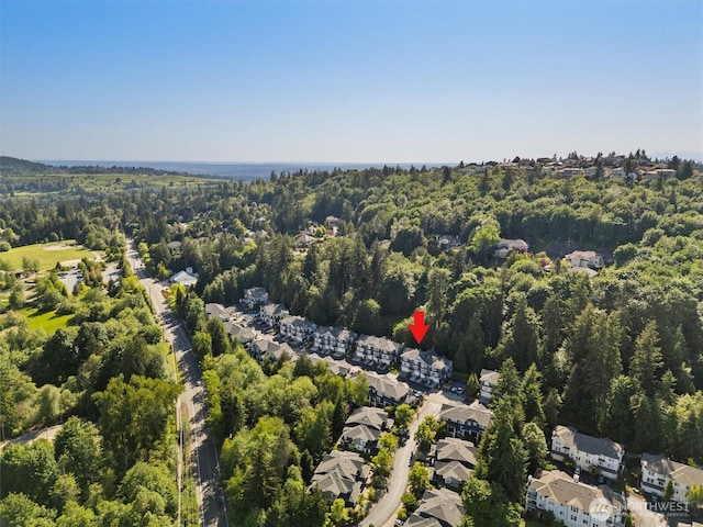 5529 Lakemont Blvd SE Unit 901, Bellevue, WA 98006 - aerial view of property and surrounding area featuring a heavily wooded area and nearby suburban area